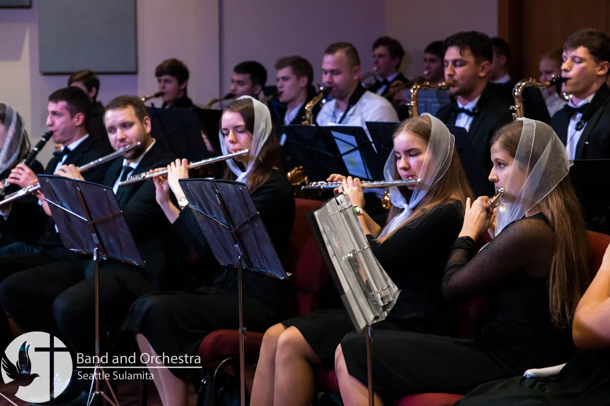 Sulamita orchestra members playing during a service
